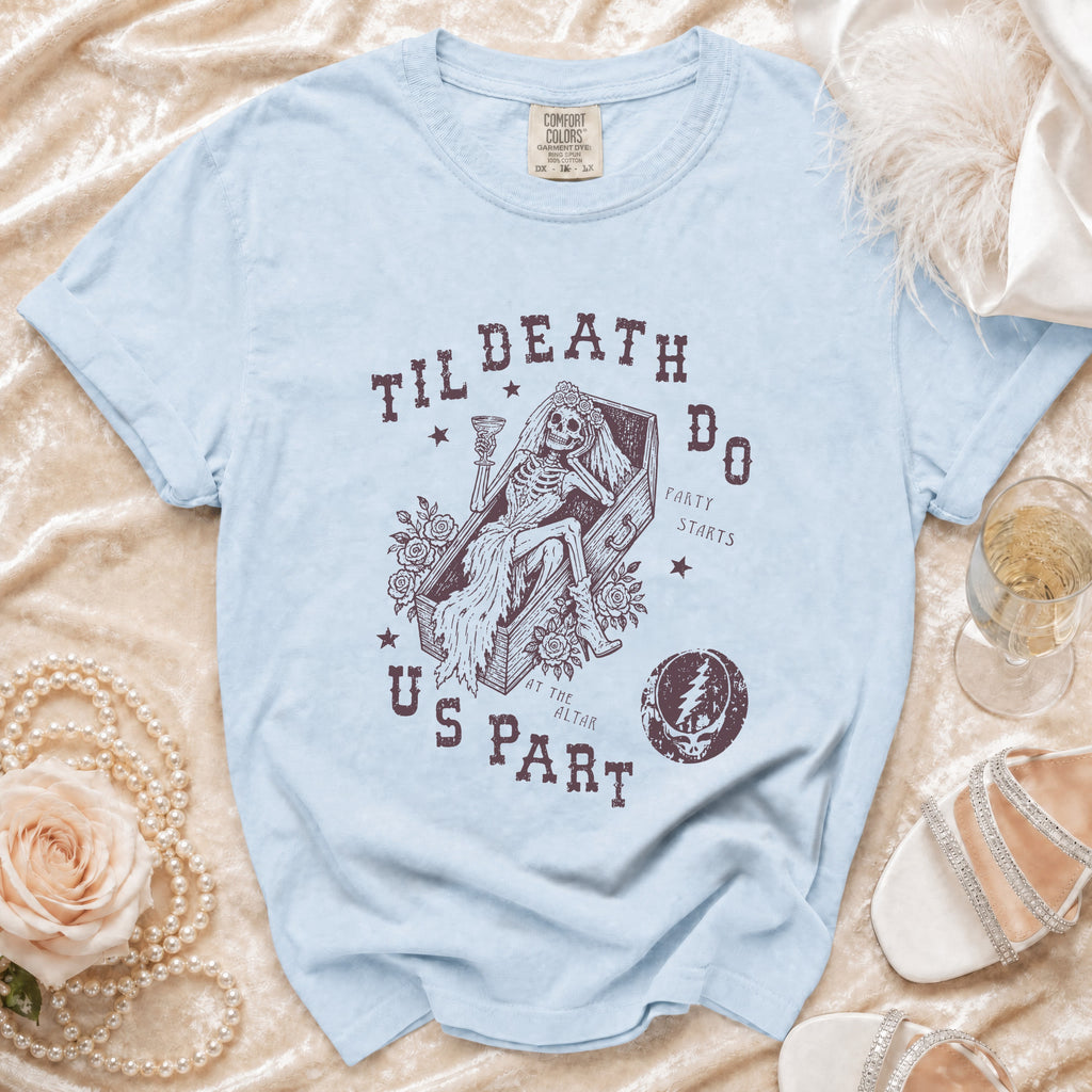 Light blue t-shirt with a graphic of a skeleton bride in a coffin, "Til Death Do Us Part" text, and a Grateful Dead skull.