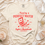 Cream t-shirt with red text and graphic: "Found my PERFECT MATCH EST. 2025 Taylor's Bachelorette Charleston, SC".