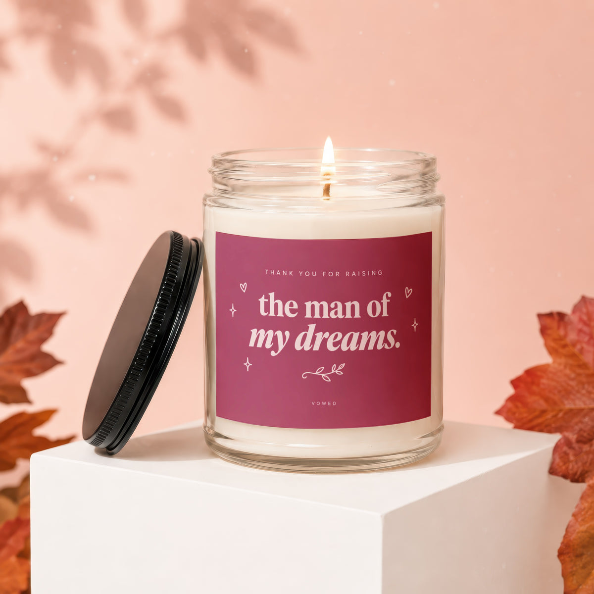 Glass candle with lit flame and label reading "Thank You For Raising the Man of My Dreams."