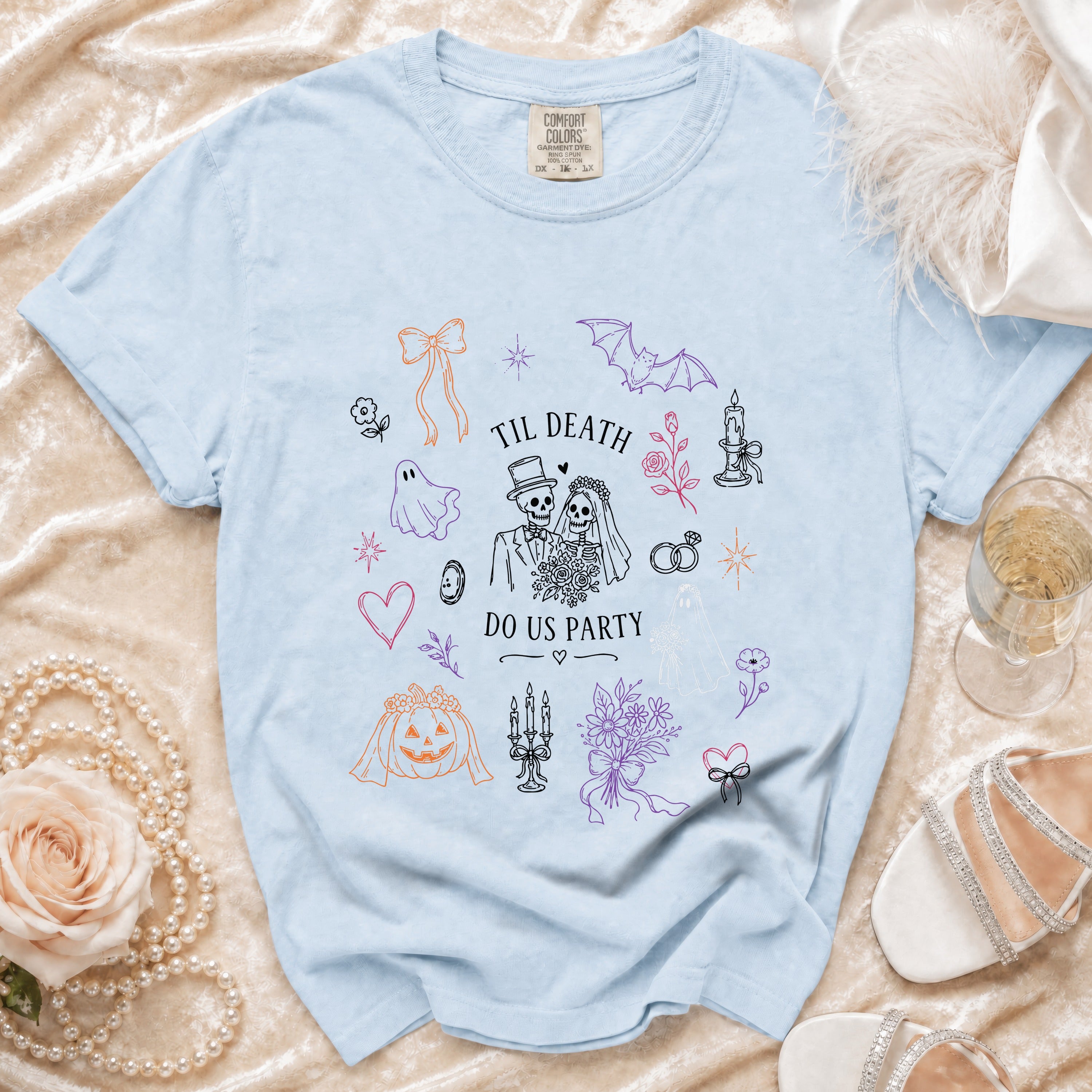 Light blue t-shirt with "Til Death Do Us Party" skeleton bride and groom graphic.