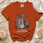 Orange t-shirt with skeleton bride graphic and text "'Til Death Looks Good On Me".