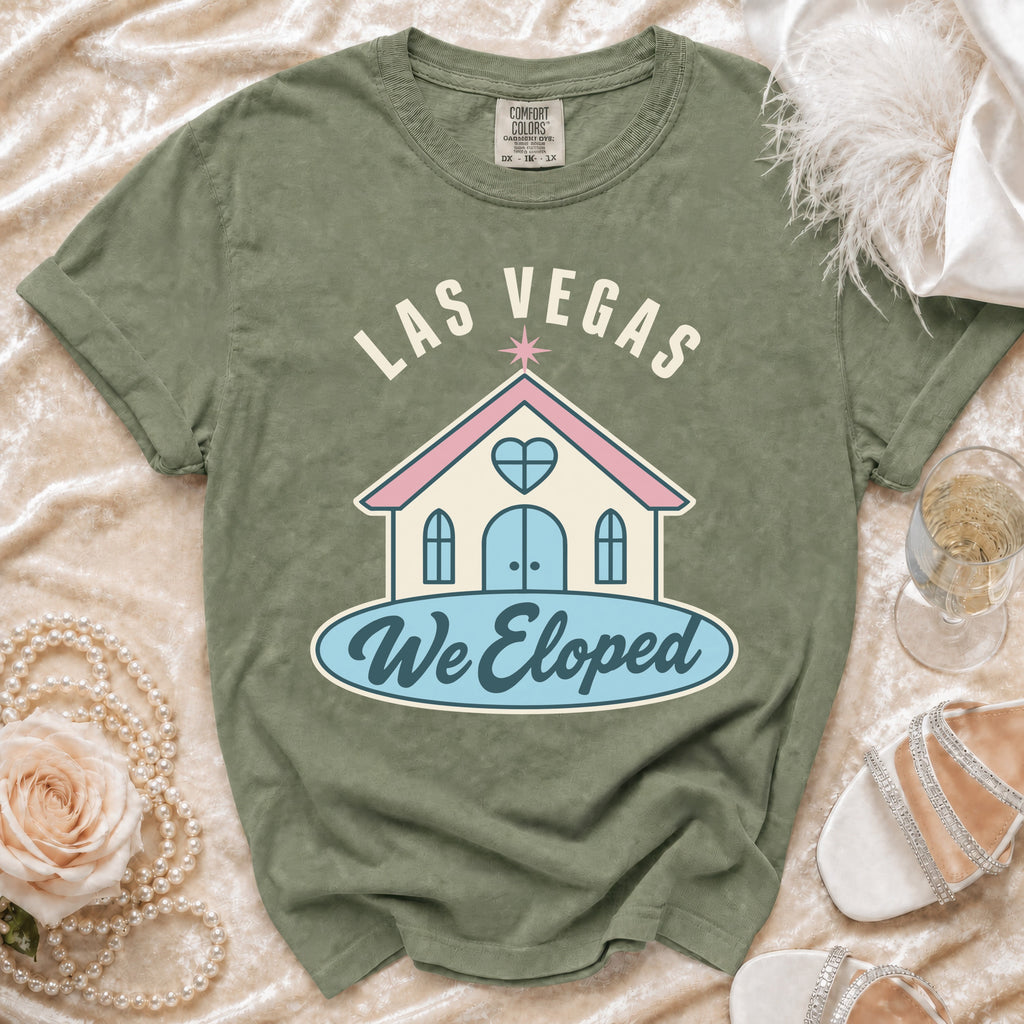 Green t-shirt with "LAS VEGAS We Eloped" text and a chapel graphic.