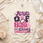Maid of Honor, AKA Chaos Coordinator text on a cream t-shirt with a ring.