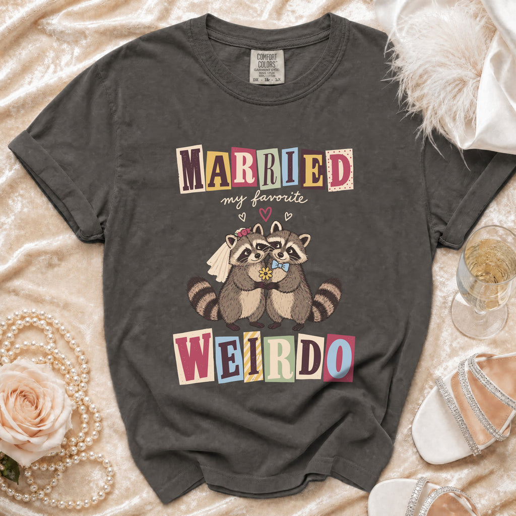 T-shirt with "Married my favorite Weirdo" and two raccoons in wedding attire.