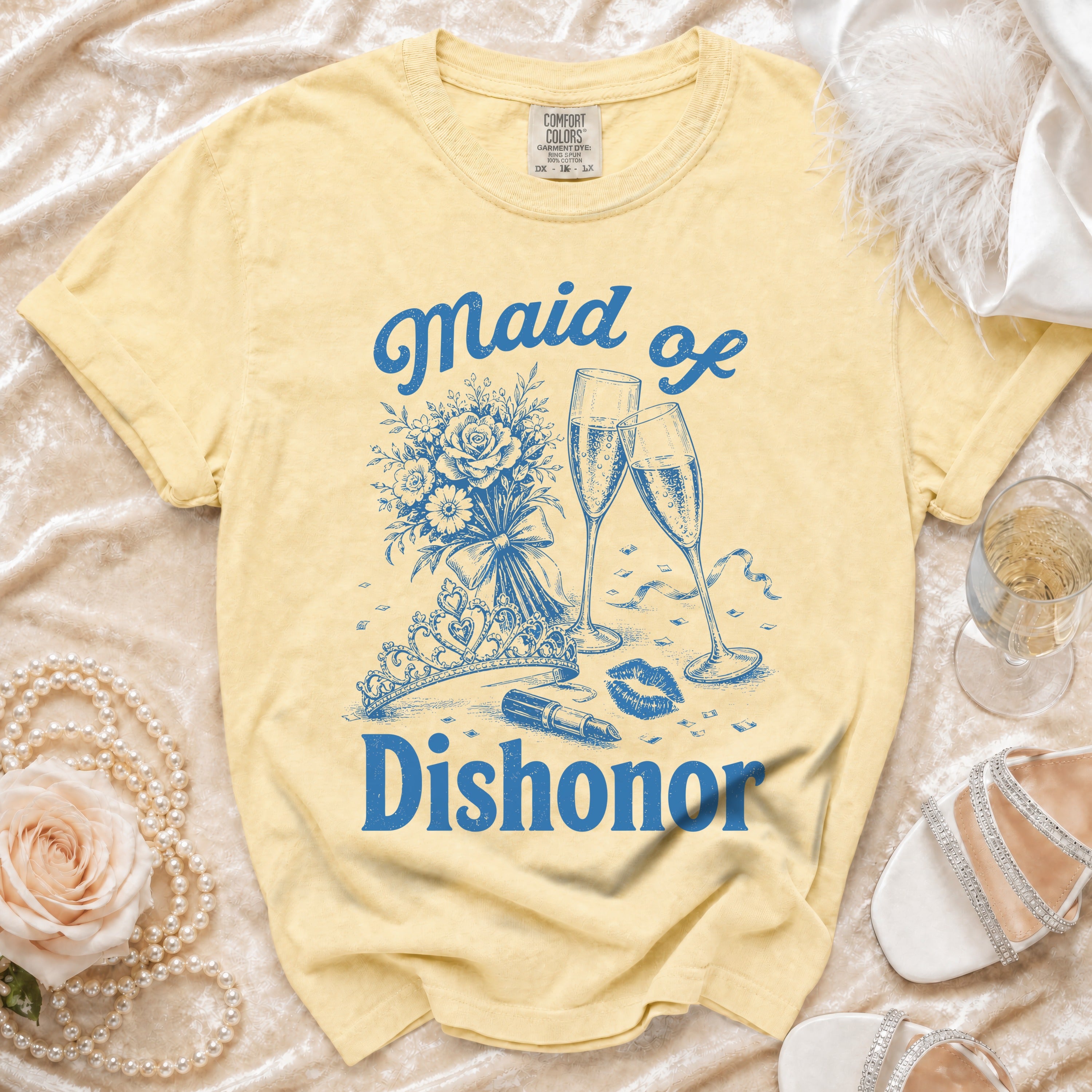 Yellow t-shirt with "Maid of Dishonor" text and graphics including champagne, lipstick, and lips.