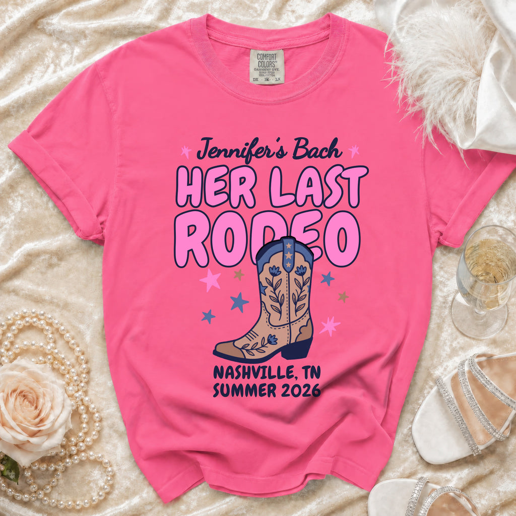 Pink t-shirt for a Nashville bachelorette party featuring cowboy boot and "Her Last Rodeo" text.