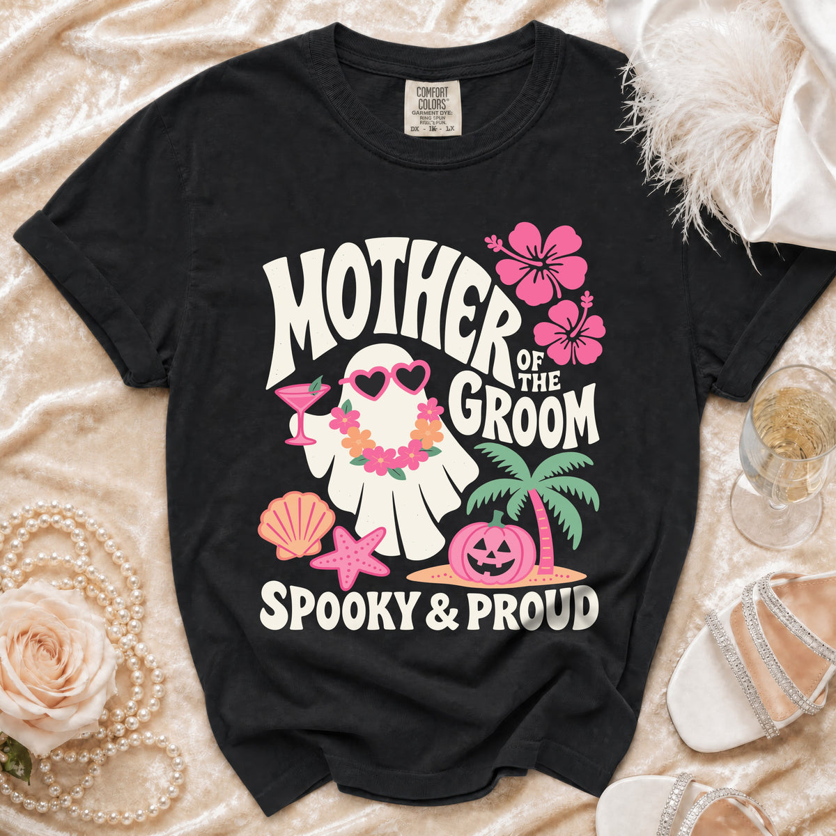 Black t-shirt with "Mother of the Groom Spooky & Proud" text and ghost graphic.