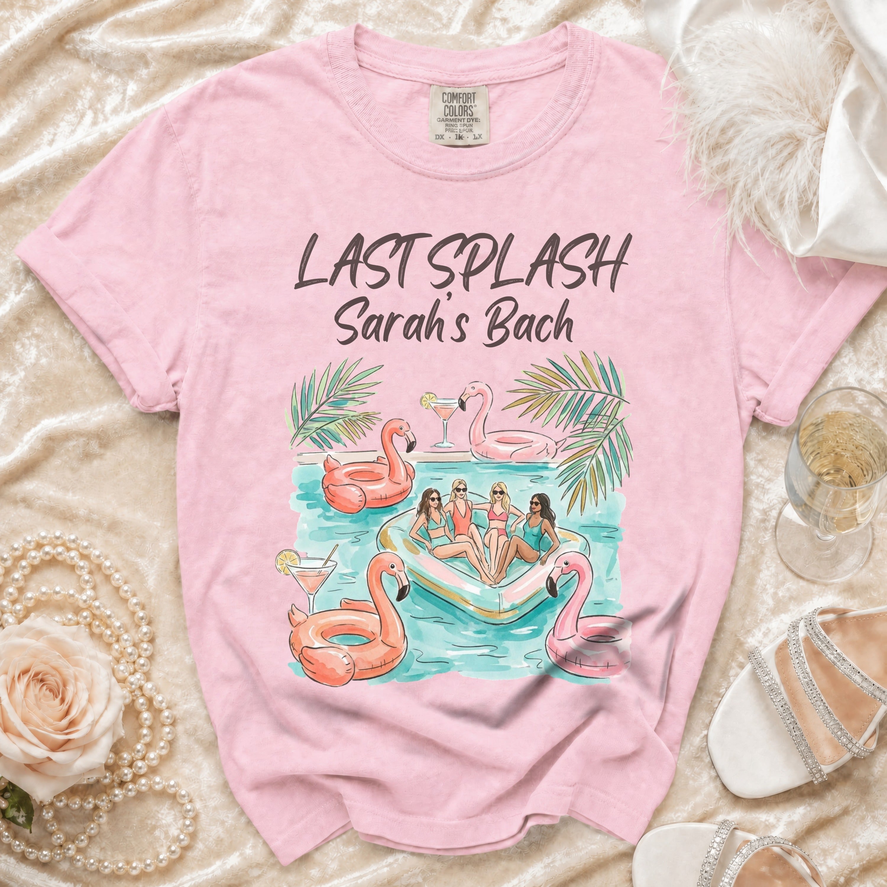 Pink t-shirt with "Last Splash Sarah's Bach" design featuring flamingos and women in pool.