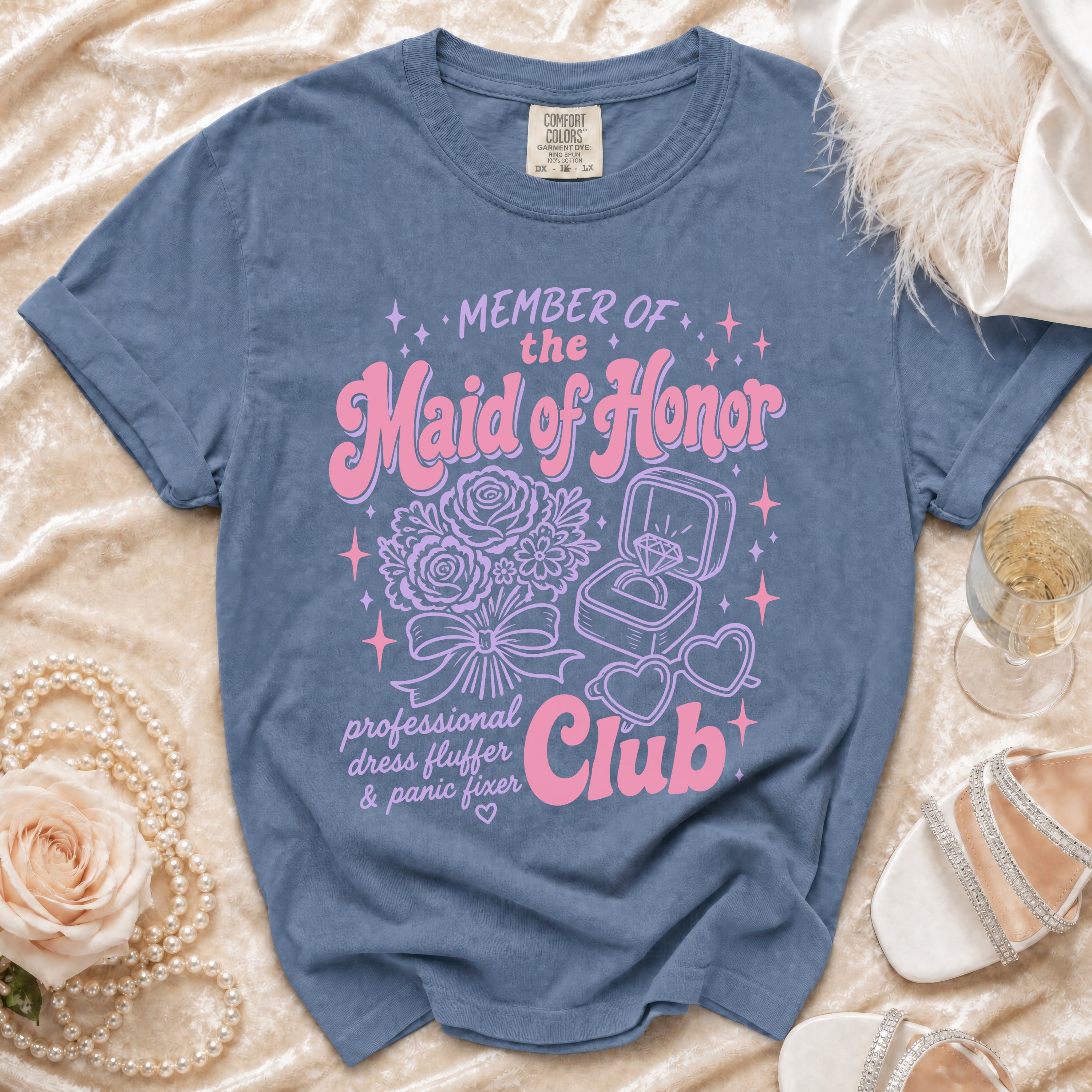 Blue t-shirt with "Member of the Maid of Honor Club" text and graphics.