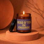 Scented candle with "Smells Like Head B*tch In Charge" text, lid off.