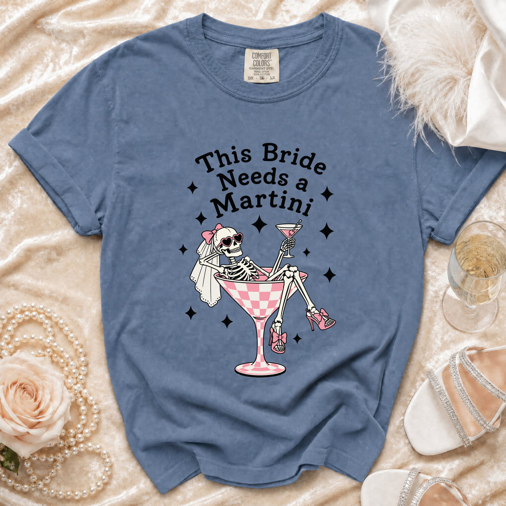 Blue t-shirt with "This Bride Needs a Martini" text and skeleton graphic.