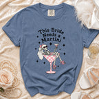 Blue t-shirt with "This Bride Needs a Martini" text and skeleton graphic.