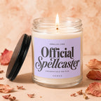 Candle with lavender label that reads "Smells like Official Spellcaster".