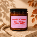 Amber jar candle with pink label reading "Wedding planning may cause loss of sleep".