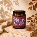 Amber candle with black lid, "Two mrs, no mister" text, VOWED.