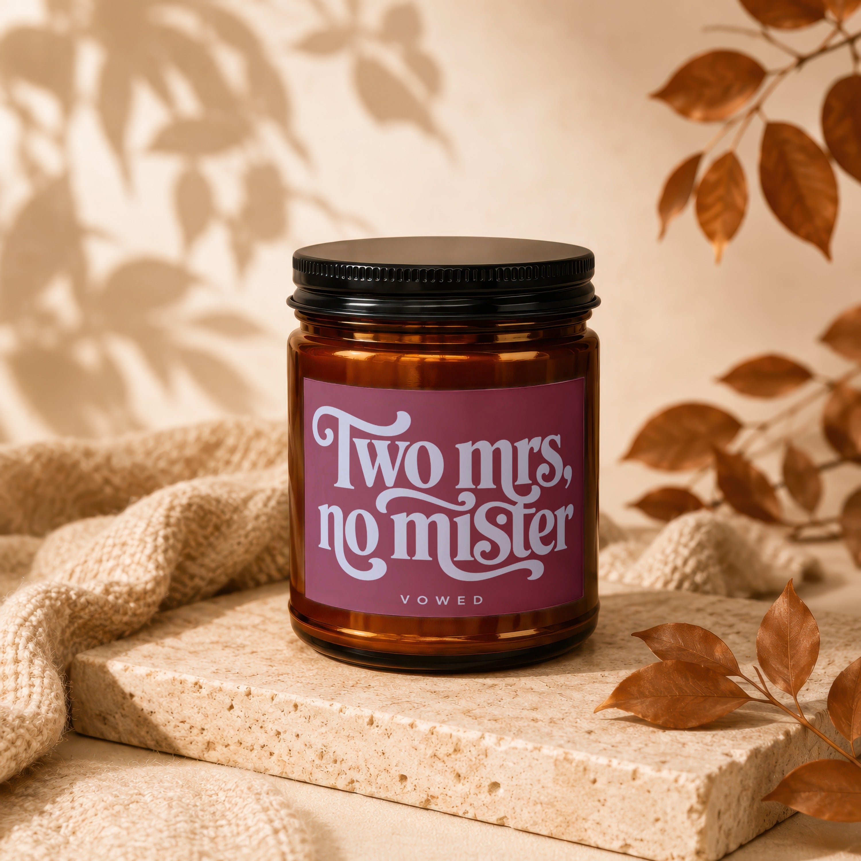 Amber candle with black lid, "Two mrs, no mister" text, VOWED.
