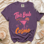 Purple t-shirt with "This Bride Needs a Cosmo" graphic and a martini glass.
