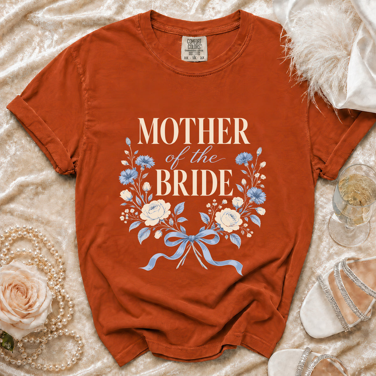 Orange t-shirt with "MOTHER of the BRIDE" text and floral design.