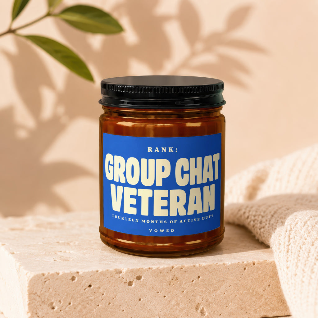 Candle with label "Rank: Group Chat Veteran Fourteen Months of Active Duty."