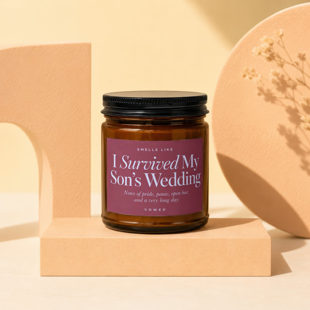 Brown candle with text "I Survived My Son's Wedding" and descriptive notes.