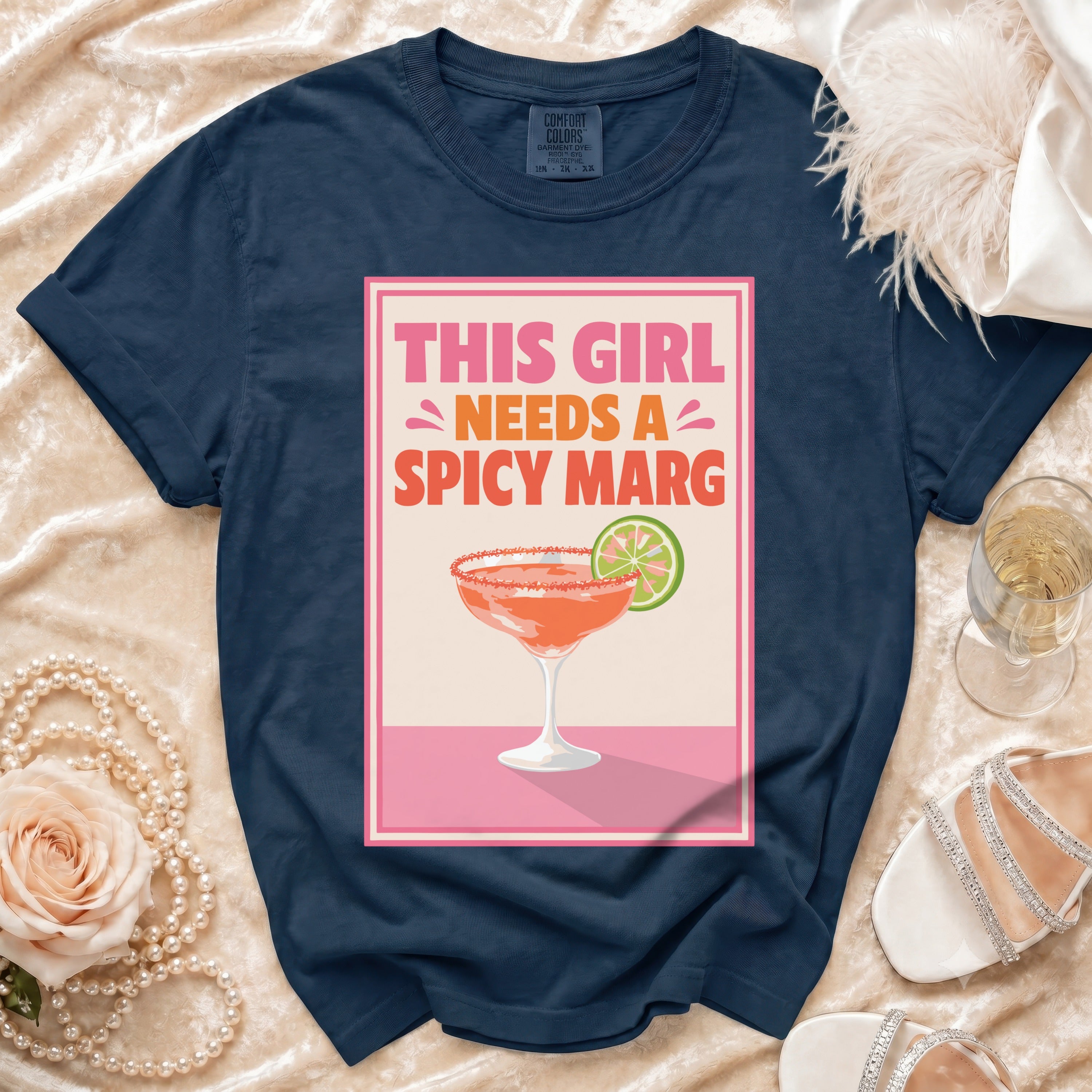 Navy Comfort Colors t-shirt with "This Girl Needs A Spicy Marg" graphic.
