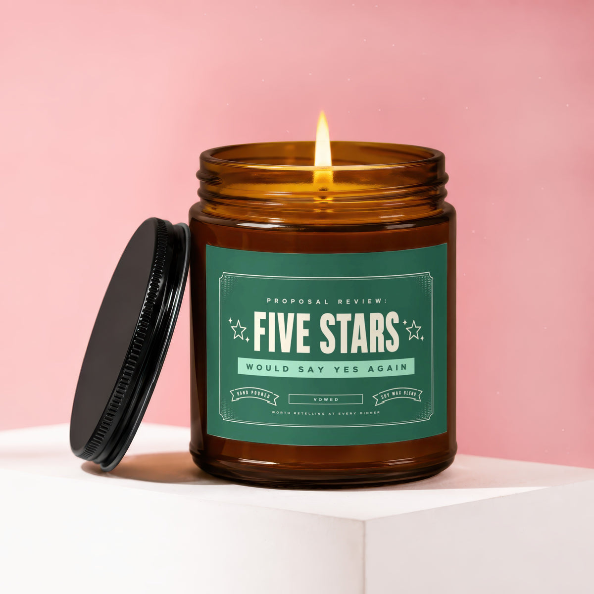 Amber jar candle with a lit flame, green label reading "Five Stars" and "Would Say Yes Again".