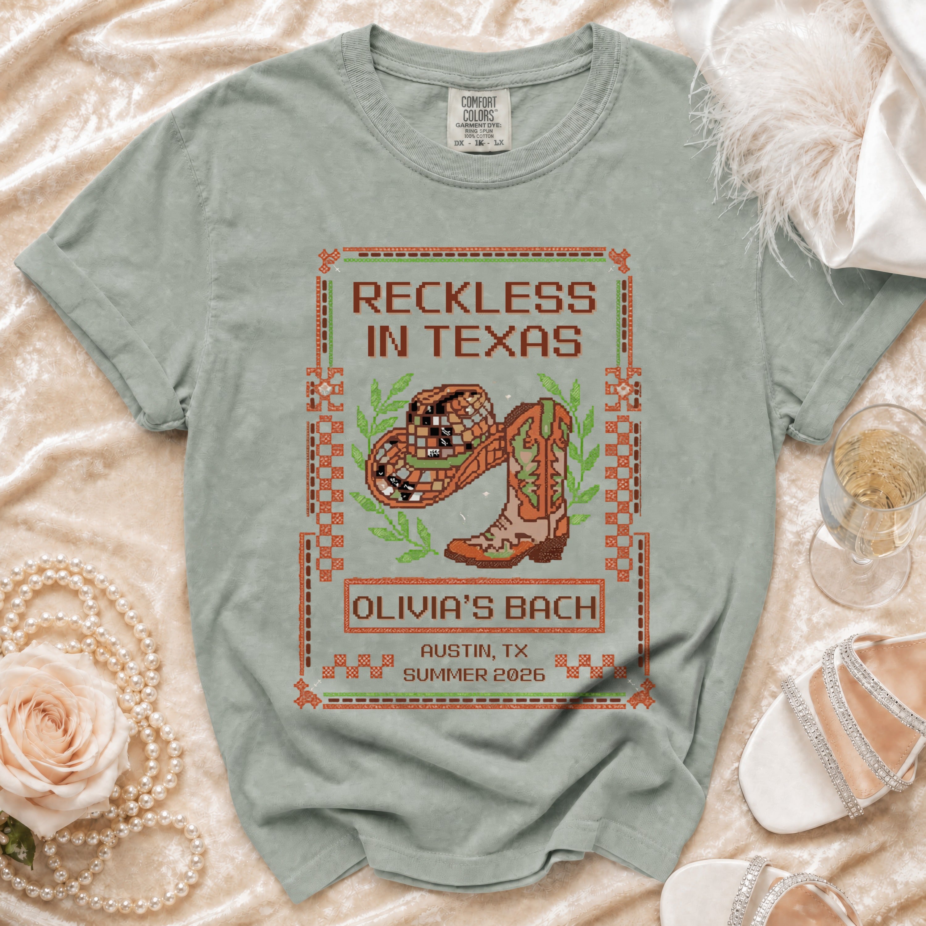 T-shirt with "Reckless in Texas" and cowboy boot graphic, for Olivia's Bach in Austin.