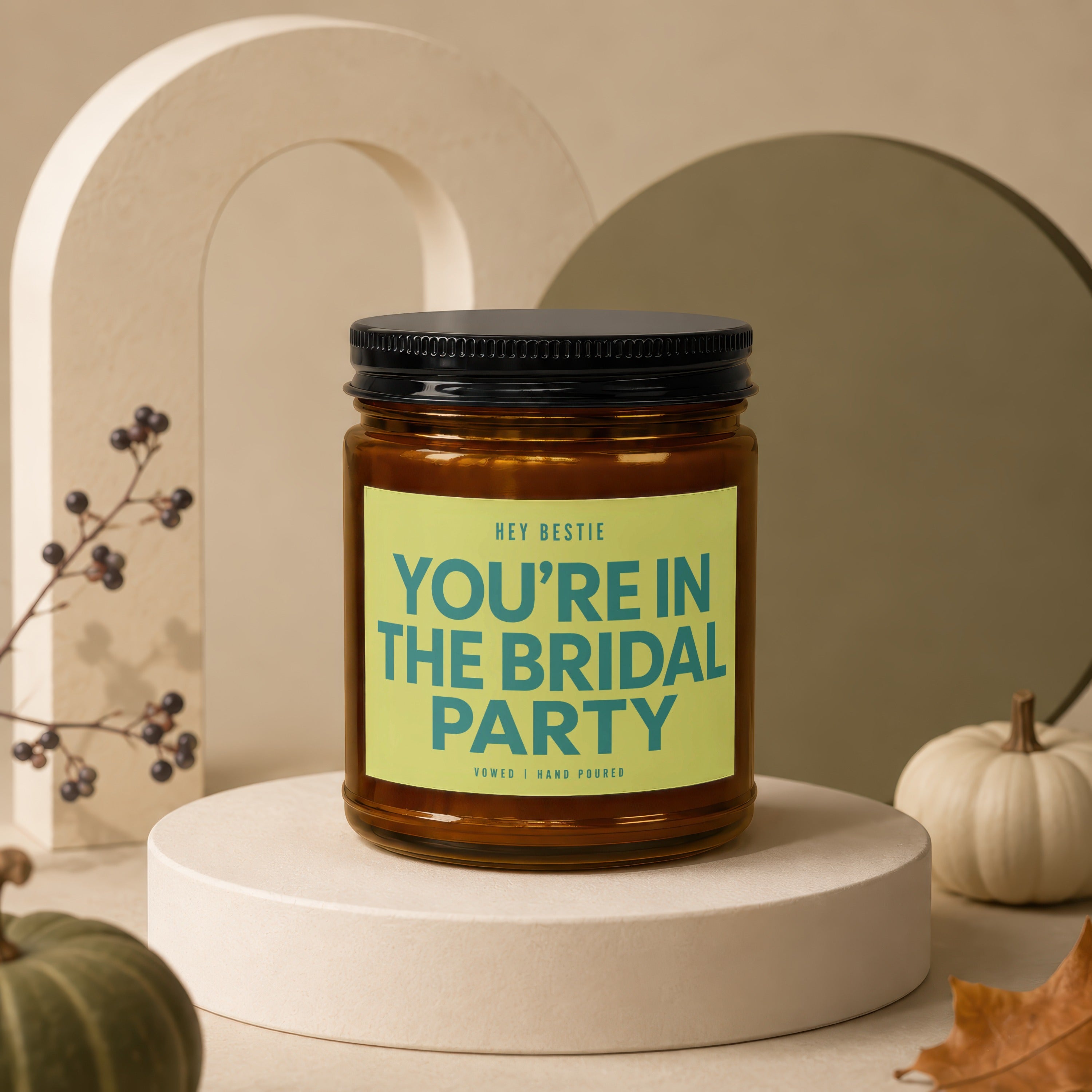 Amber jar candle with black lid, featuring text "HEY BESTIE YOU'RE IN THE BRIDAL PARTY."