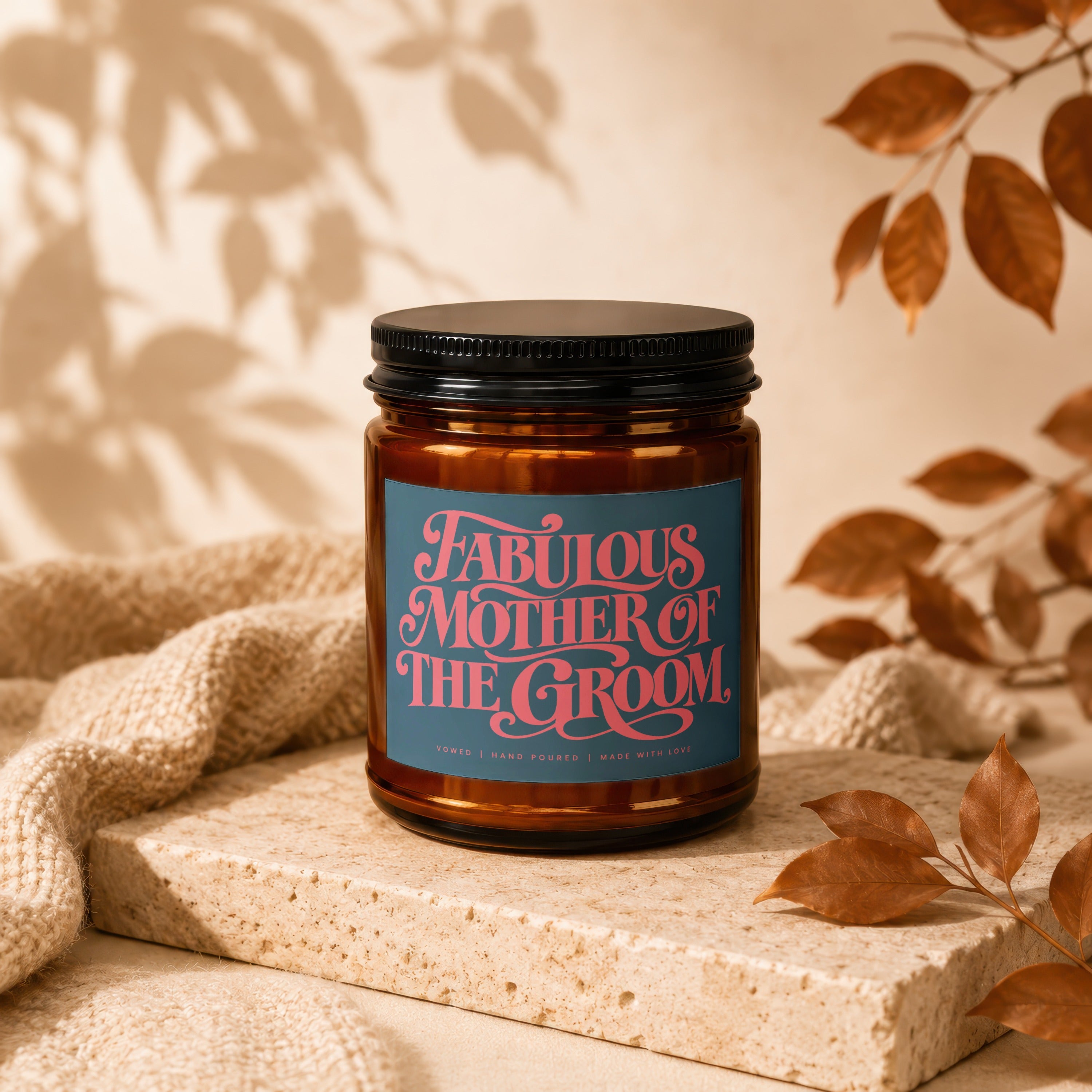 Amber jar candle with a blue label reading "Fabulous Mother of the Groom."
