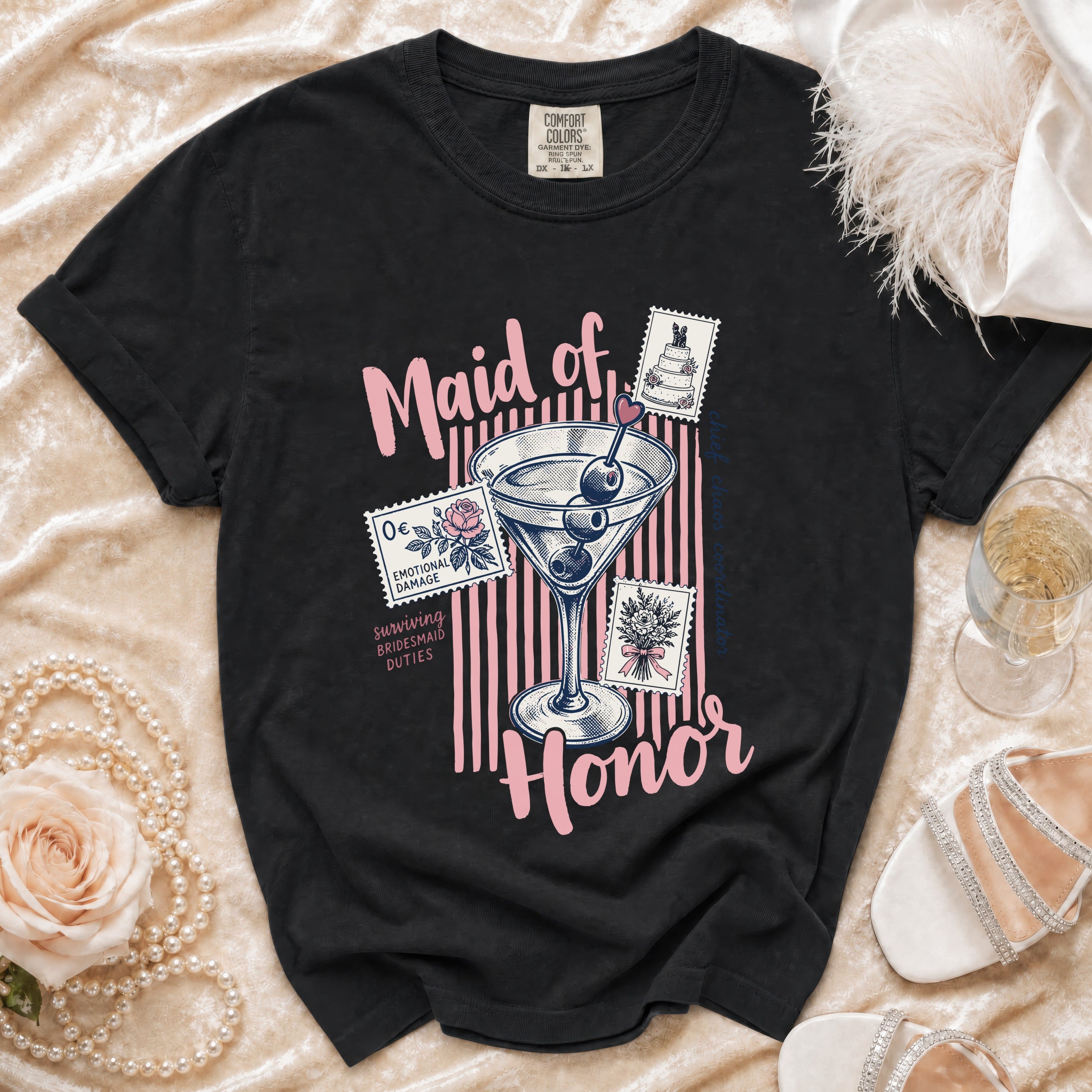 Black t-shirt with "Maid of Honor" text, martini glass, and stamps.