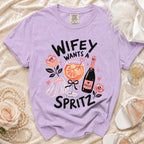Purple t-shirt with "Wifey Wants a Spritz" text, prosecco, and cocktail.