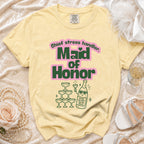 Yellow t-shirt with "Maid of Honor" text and champagne graphics.