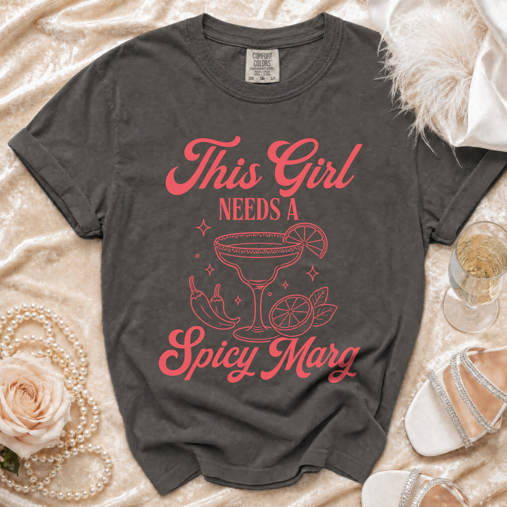 Dark grey t-shirt with "This Girl NEEDS A Spicy Marg" graphic.