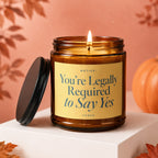 Candle with text "NOTICE: You're Legally Required to Say Yes" and "VOWED".