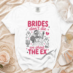 White t-shirt with "BRIDES don't die we ghost THE EX" text and skeleton bride graphic.