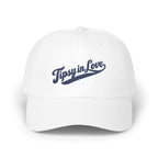 A white baseball cap featuring blue embroidered text that reads Tipsy in Love on the front.