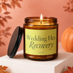 Lit amber candle with "Wedding Hex Recovery" and "VOWED" on yellow label.