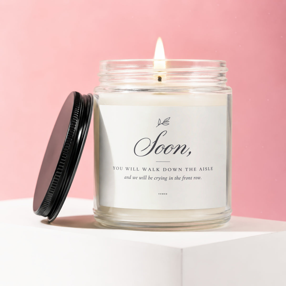 Scented candle with label that reads "Soon, YOU WILL WALK DOWN THE AISLE and we will be crying in the front row."