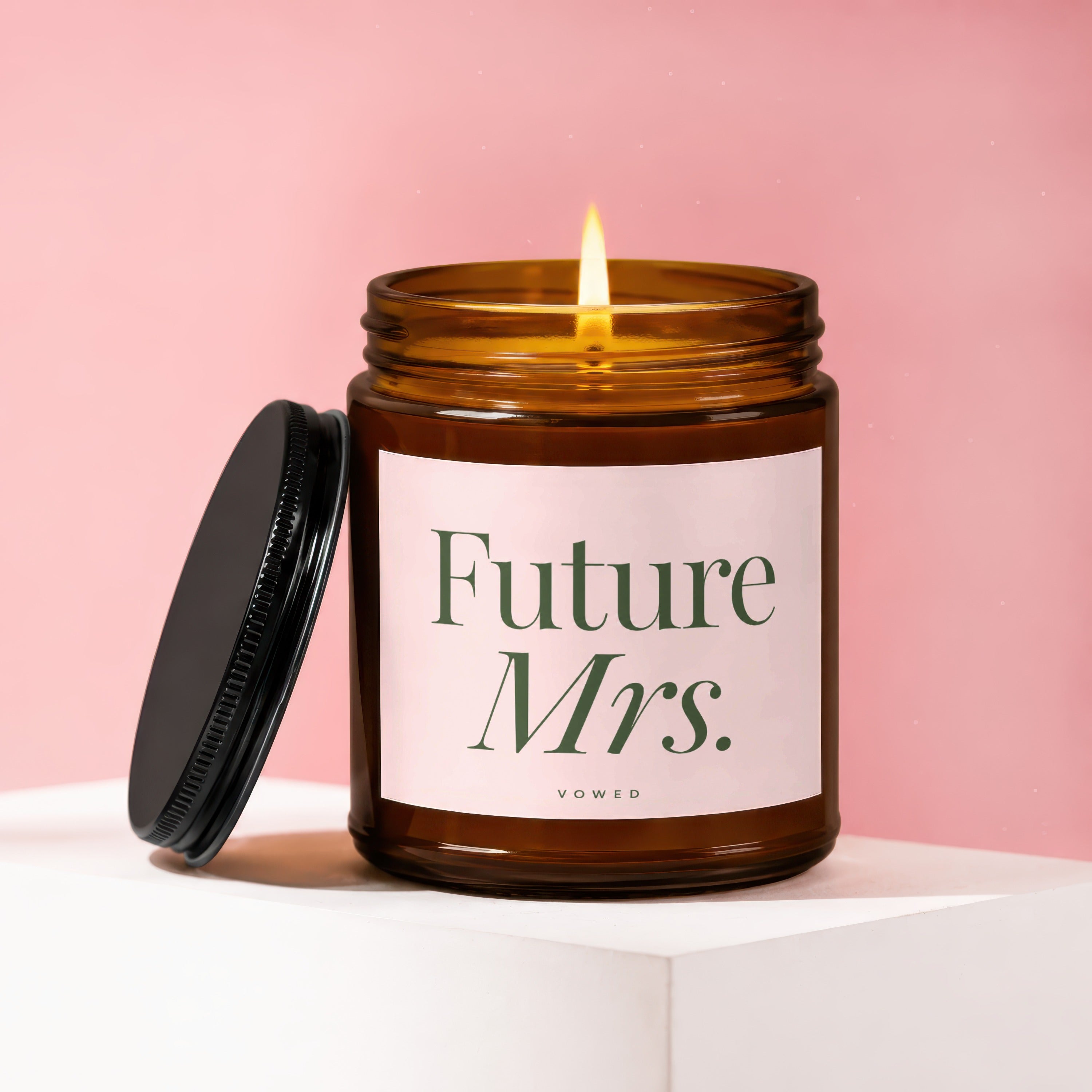 Amber jar candle with lit flame and "Future Mrs." text