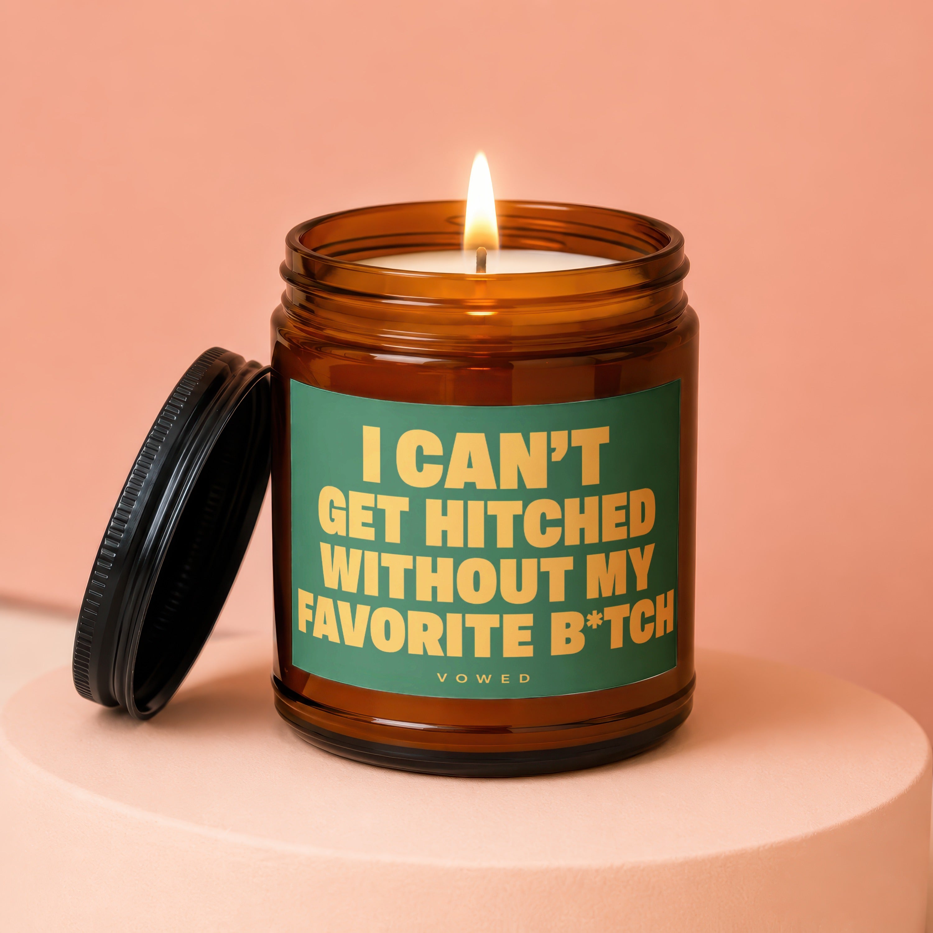 Candle with "I can't get hitched without my favorite b*tch" text.