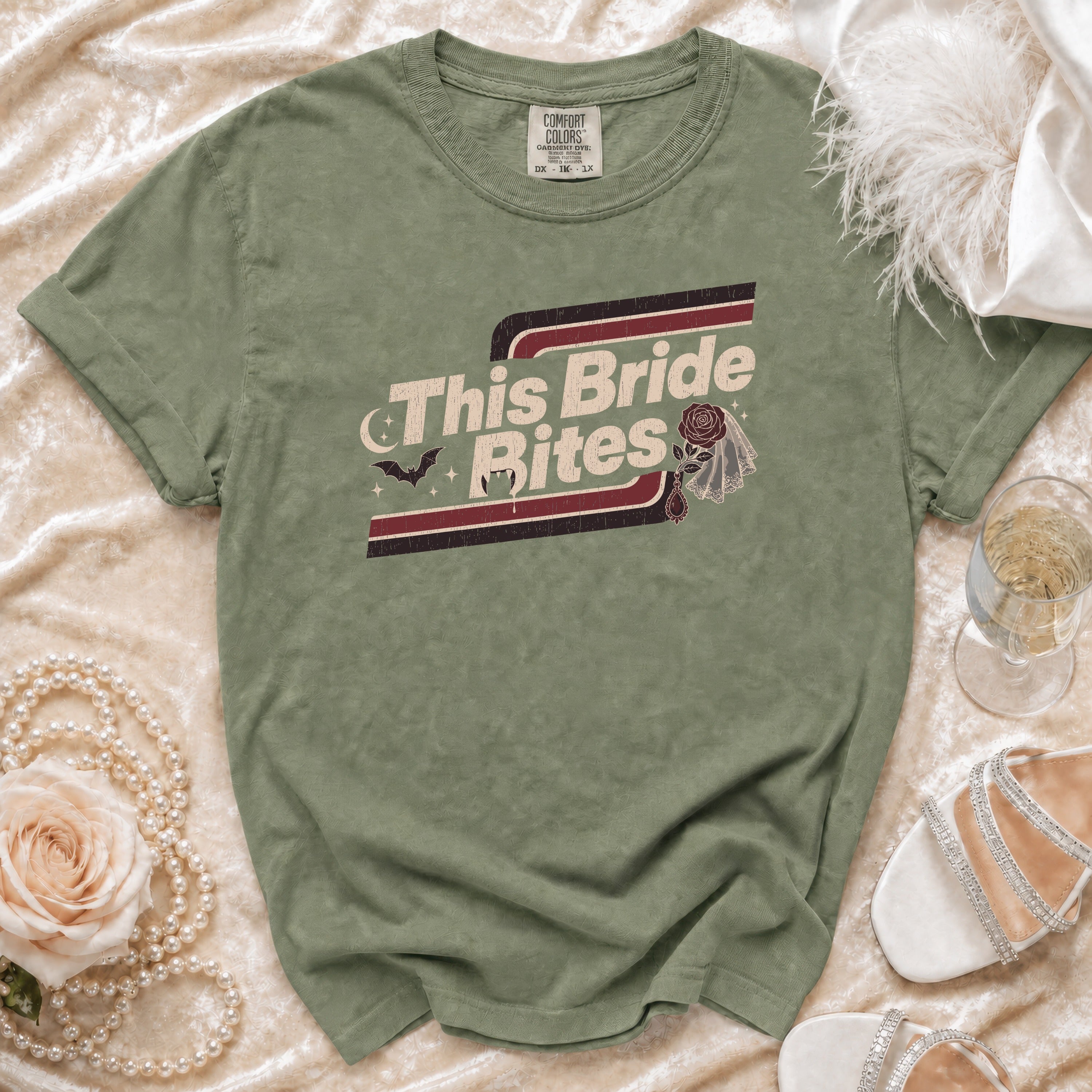 Green t-shirt with "This Bride Bites" graphic featuring a bat and fangs.