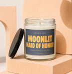Glass jar candle with black lid, featuring label that reads "Appointed: Moonlit Maid of Honor Vowed".