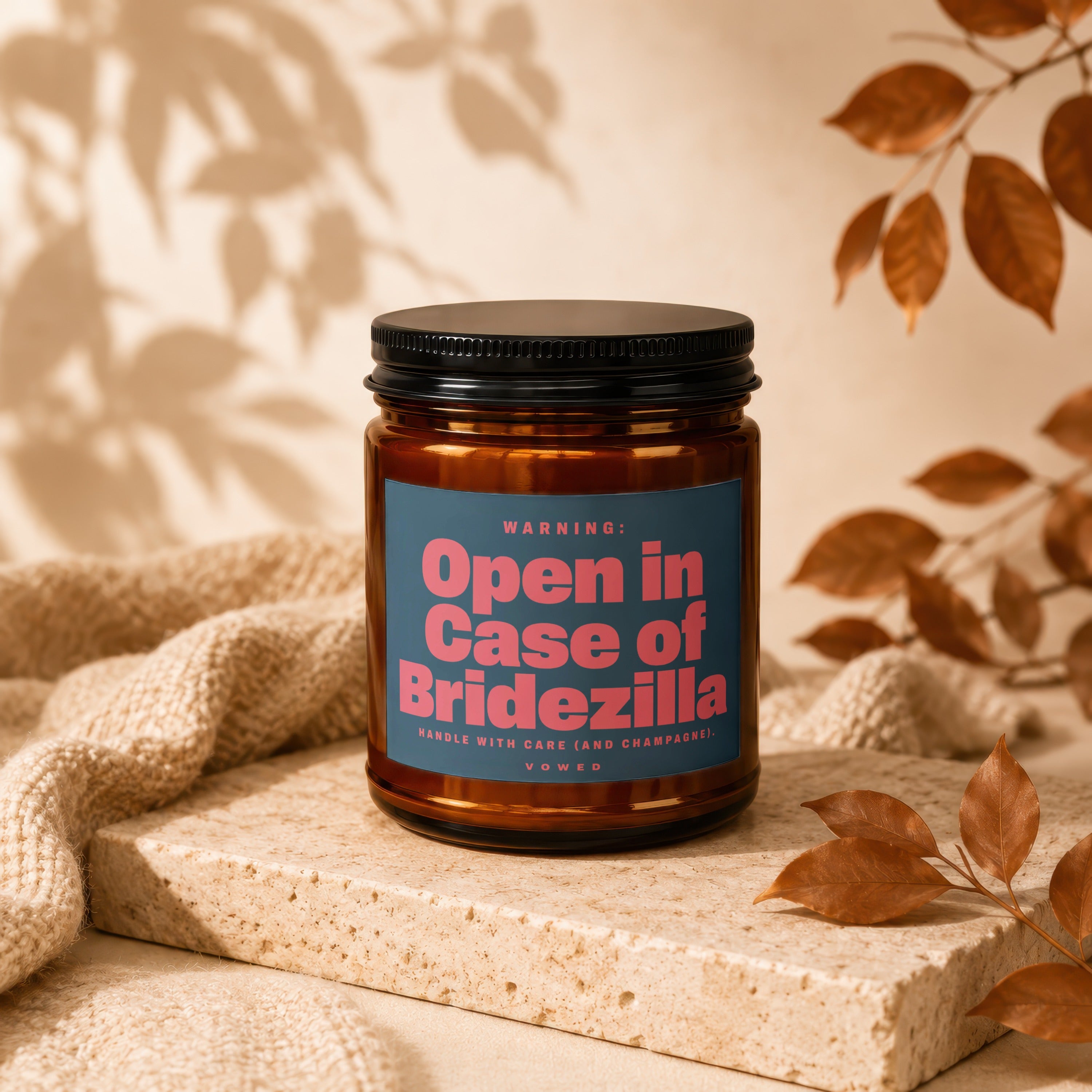 Amber candle with a blue label reading "Open in Case of Bridezilla".