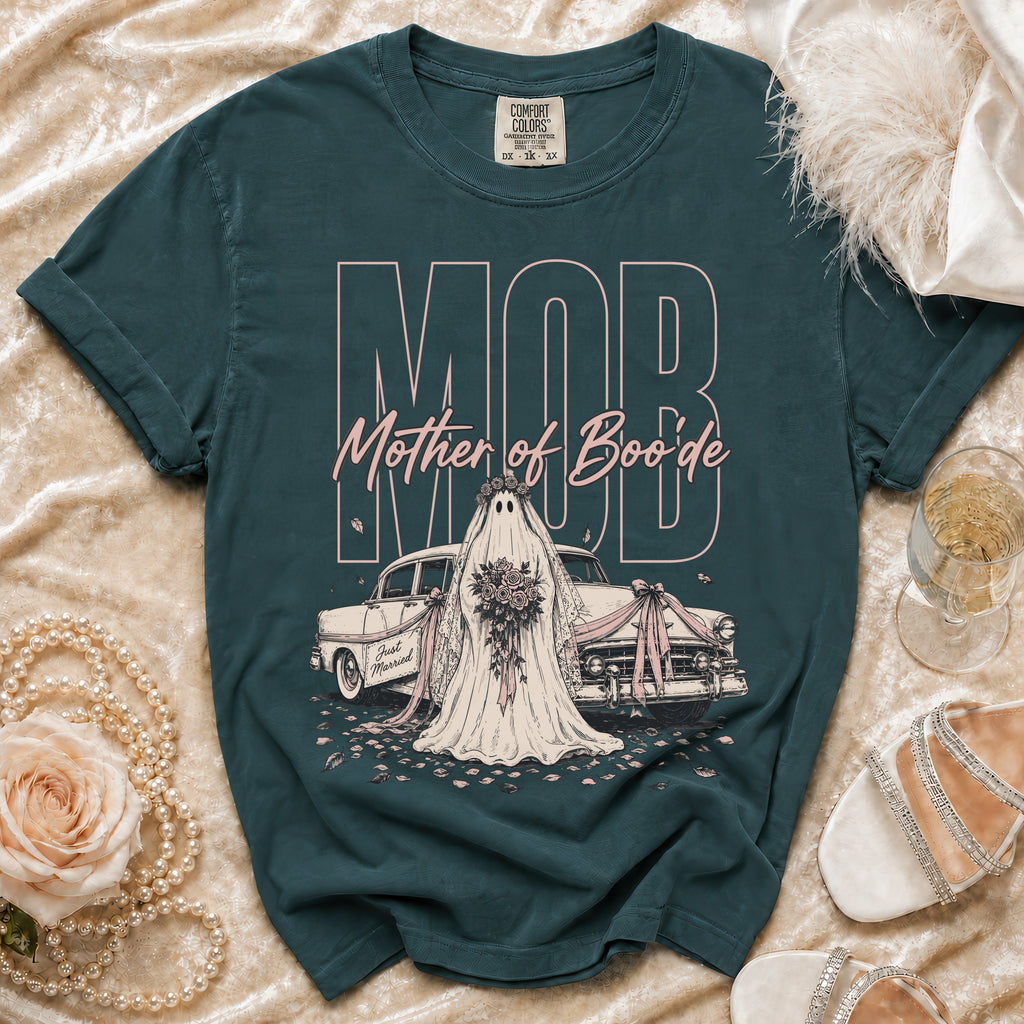 Dark teal crewneck t-shirt featuring a pink ghost bride graphic, vintage car, and Mother of Boo'de text.
