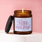 Amber candle burning with "Love, out loud" text and "vowed" below.