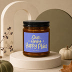 Amber jar candle with purple label reading "Our Only Happy Place" and "vowed".