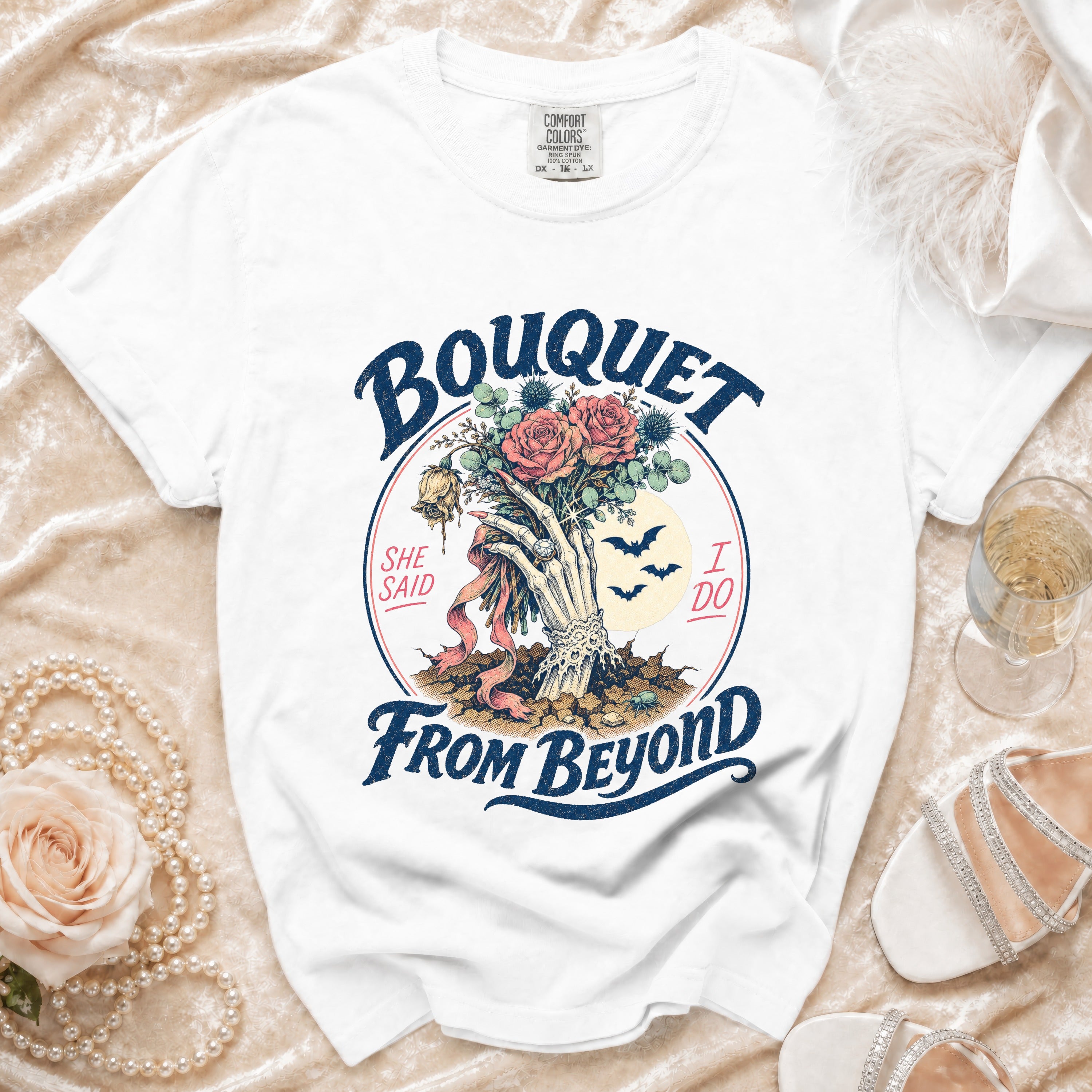 White t-shirt with "Bouquet She Said I Do From Beyond" graphic.