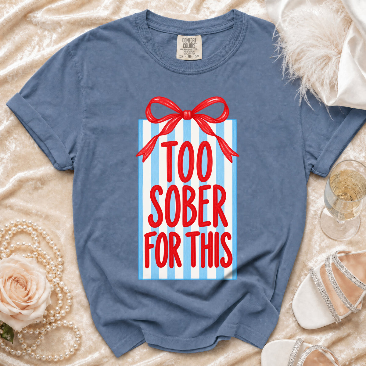 Blue t-shirt with gift box graphic saying "TOO SOBER FOR THIS".