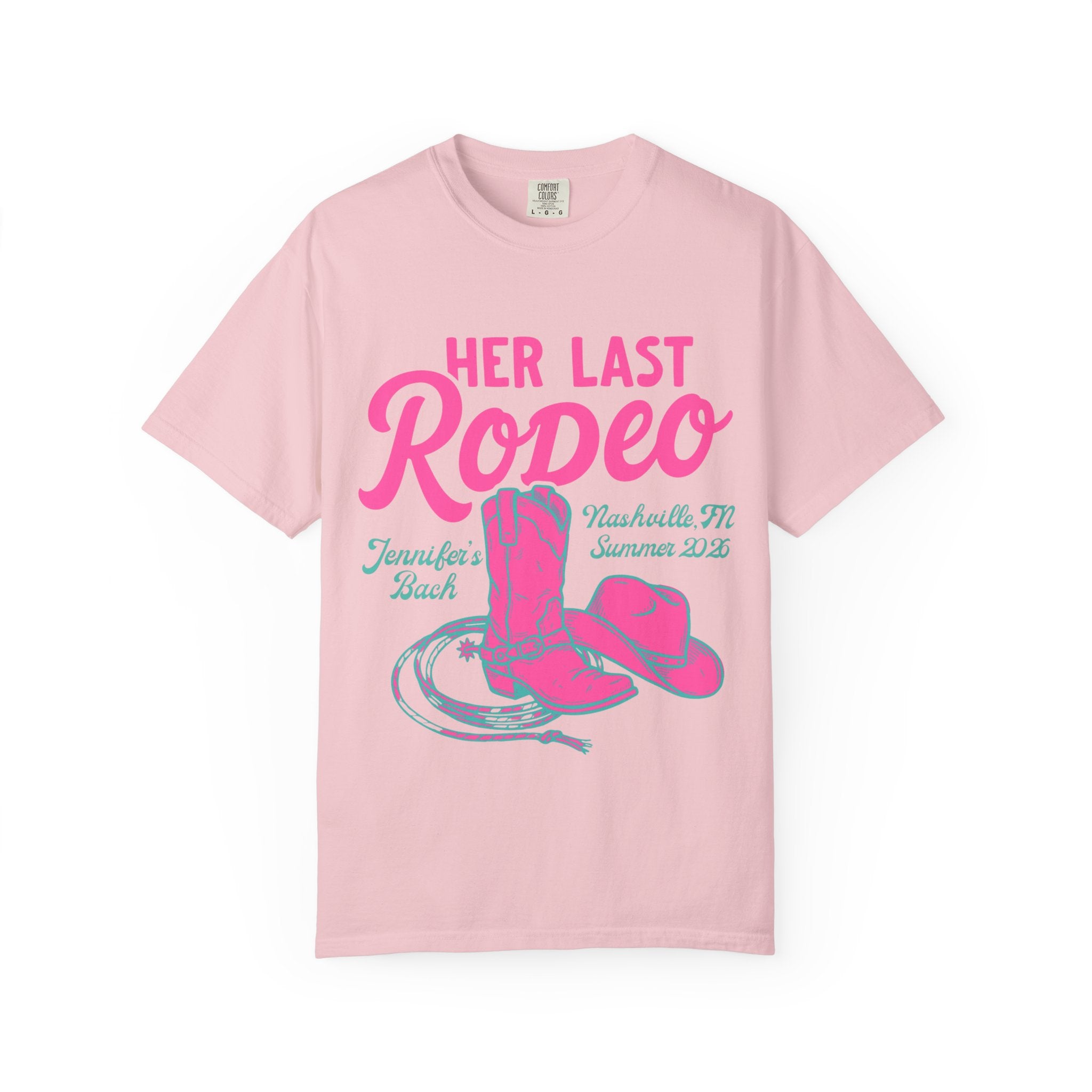 Pink t-shirt with "Her Last Rodeo" graphic, cowboy boots, and hat.