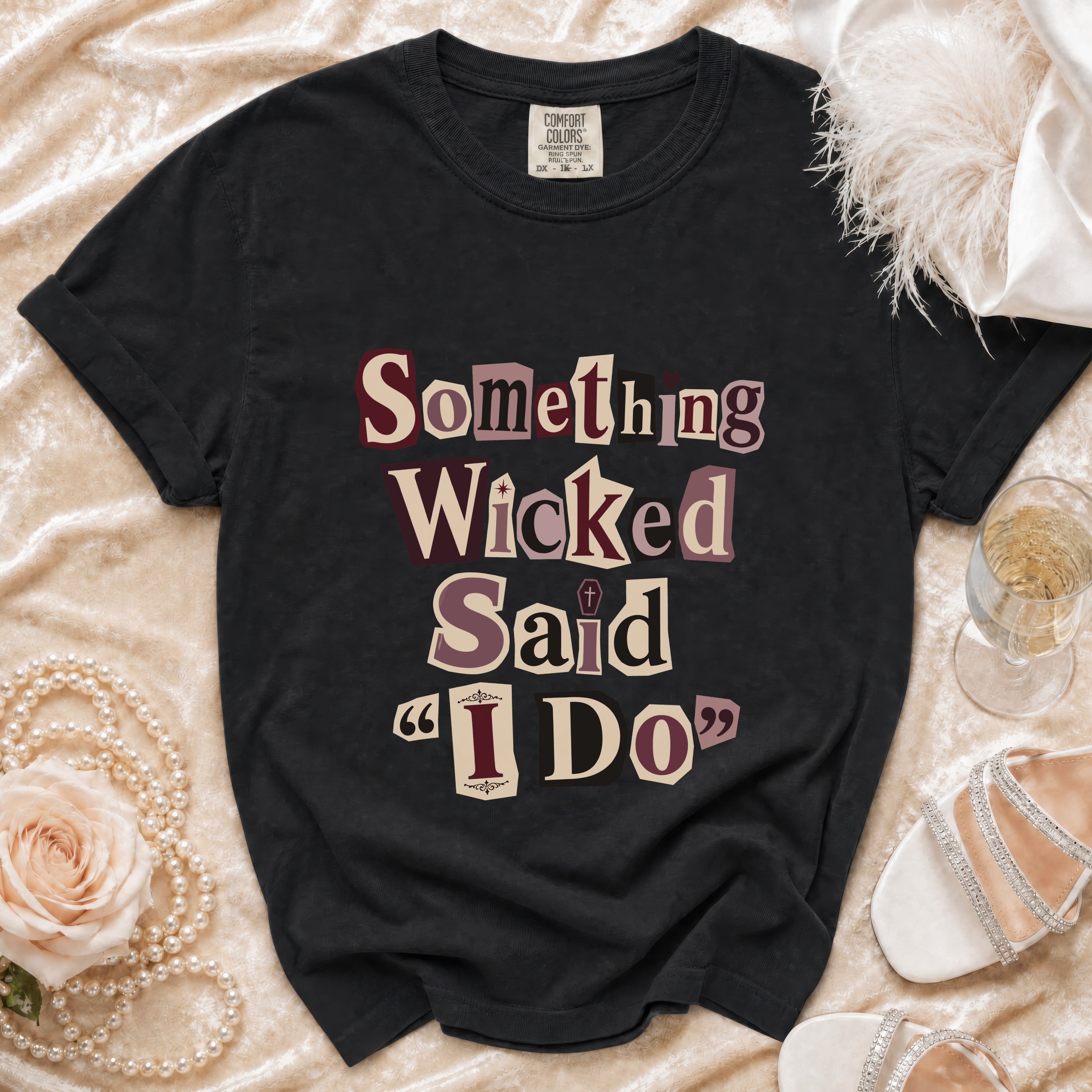 Black Comfort Colors t-shirt with "Something Wicked Said 'I Do'" text graphic.